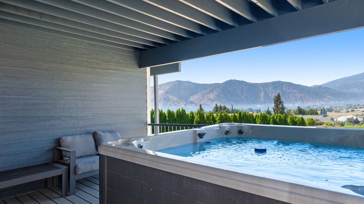 Manson House | Lake & mountain view home with hot tub, pool, 2 decks, game room, & fireplace