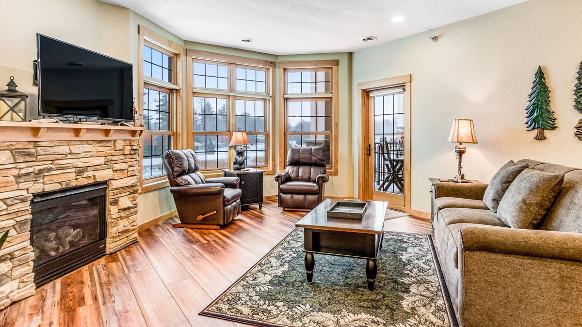 Three Lakes Condo | Lake view condo with 2 balconies, fireplace, pool, hot tubs, gym & sports courts