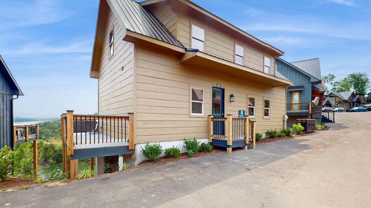 Sevierville Cabin | Lake view home w/hot tub, rocking chairs, fireplace, & free attraction tickets