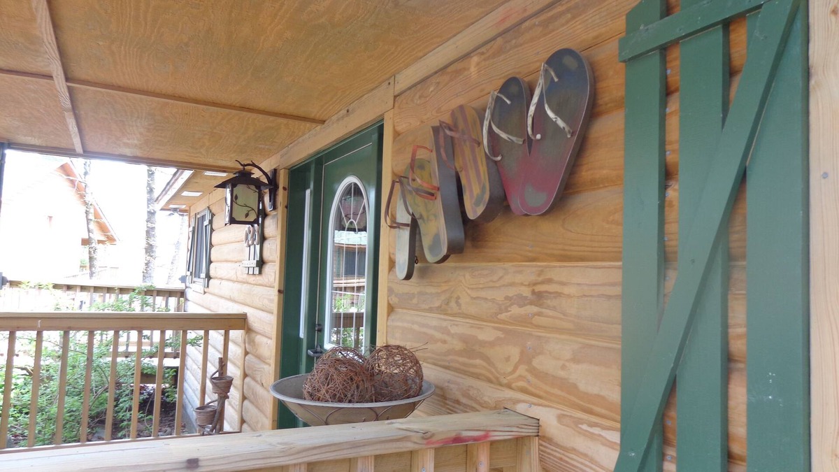 Mount Ida Cottage | Lake view two bedroom, two bath log-sided cottage with private hot tub overlooking Lake Ouachita. by RedAwning