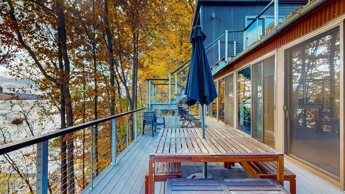 Valois House | Lakefront contemporary gem with decks, lake views & pebble beach