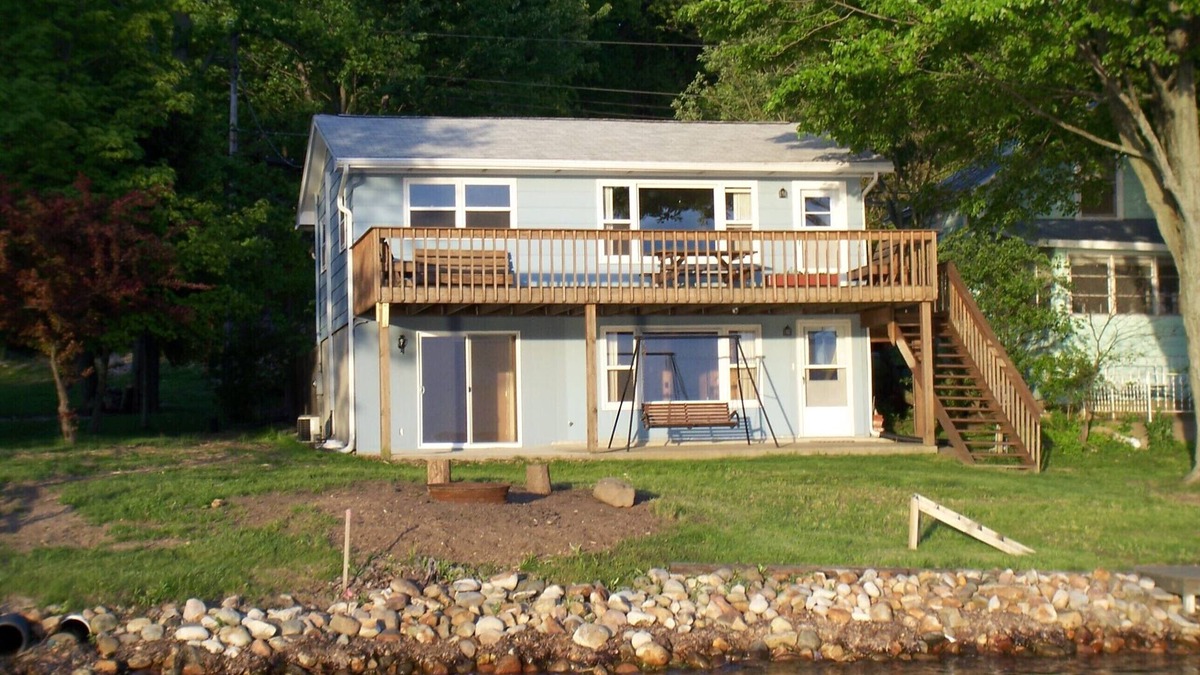 Angola Cottage | Lakefront cottage on first basin of Lake James. Dock, sandy bottom, great sunset