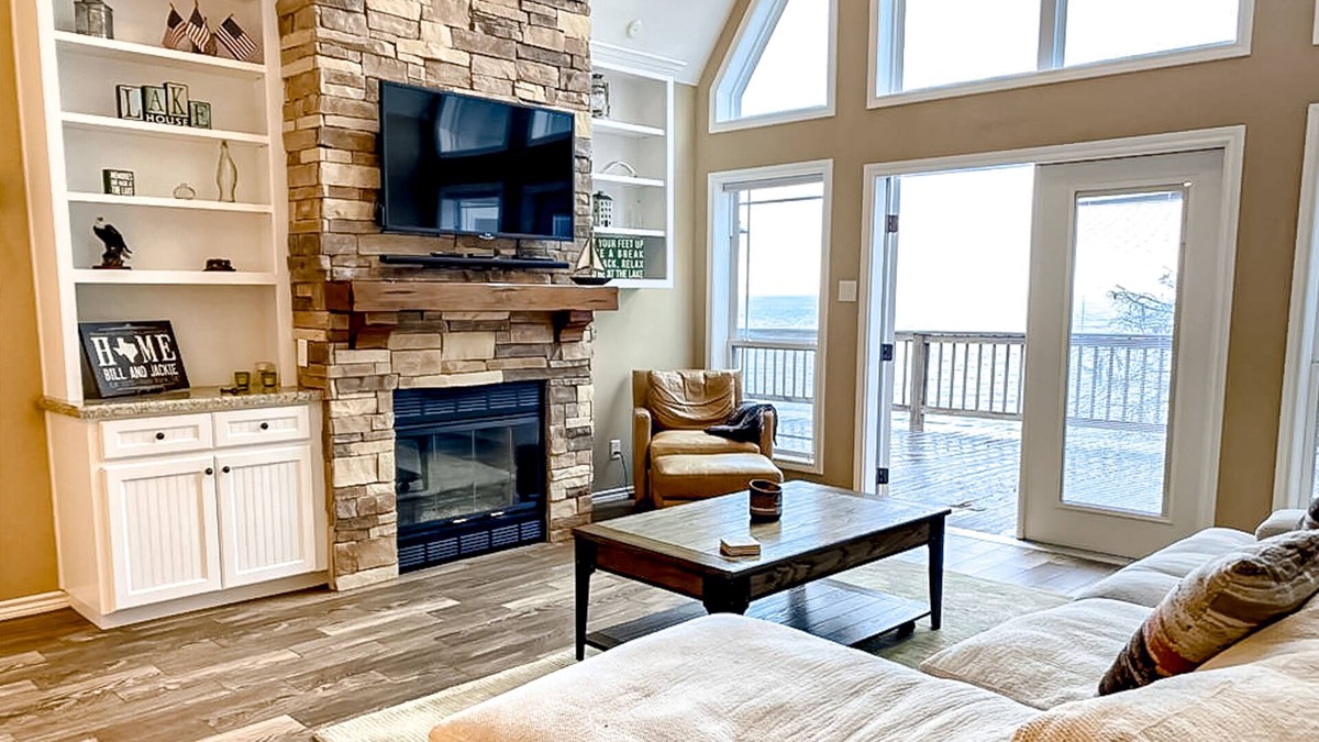 Pointblank House | Lakefront dog-friendly home with alfresco dining, balcony, & fireplace