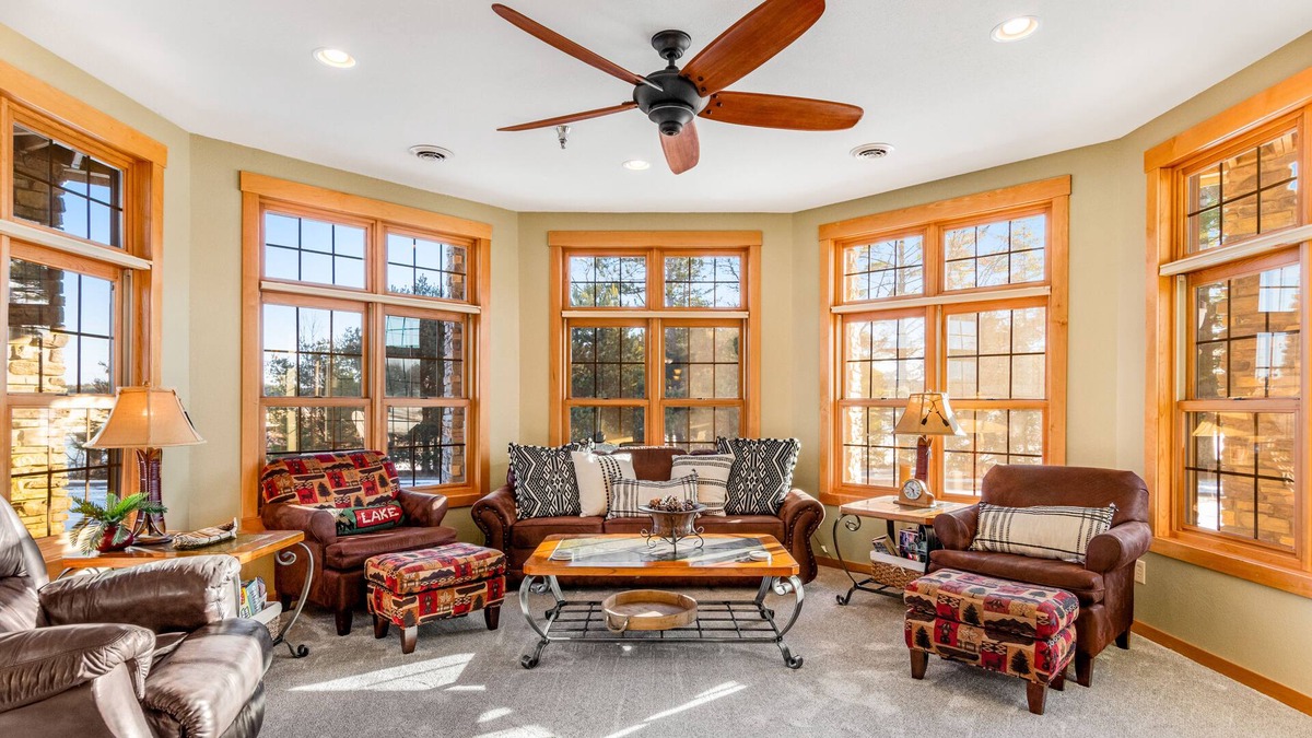 Three Lakes Condo | Lakefront, ground-floor condo with fireplace, patio, private grill & firepit