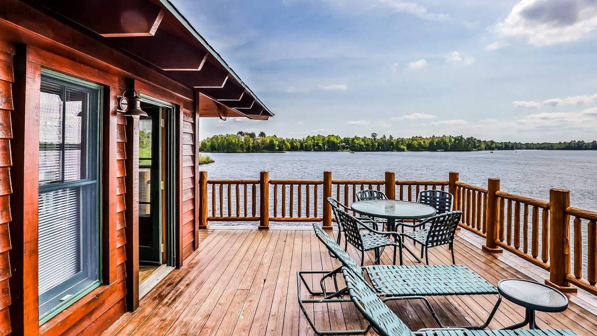 Manitowish Waters Condo | Lakefront home with large deck, gas grill, wood fireplace, heated pool, firepit
