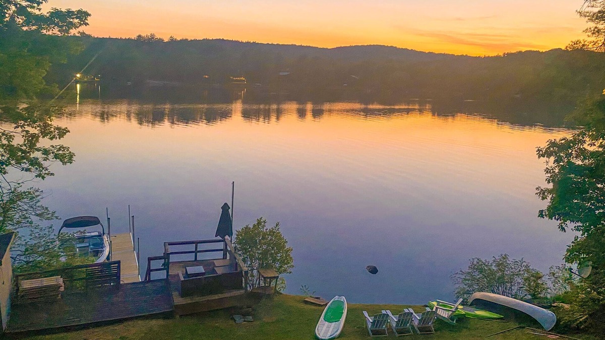 Castleton House | Lakefront home near ski resorts with water view, dock, deck, fireplaces, & W/D