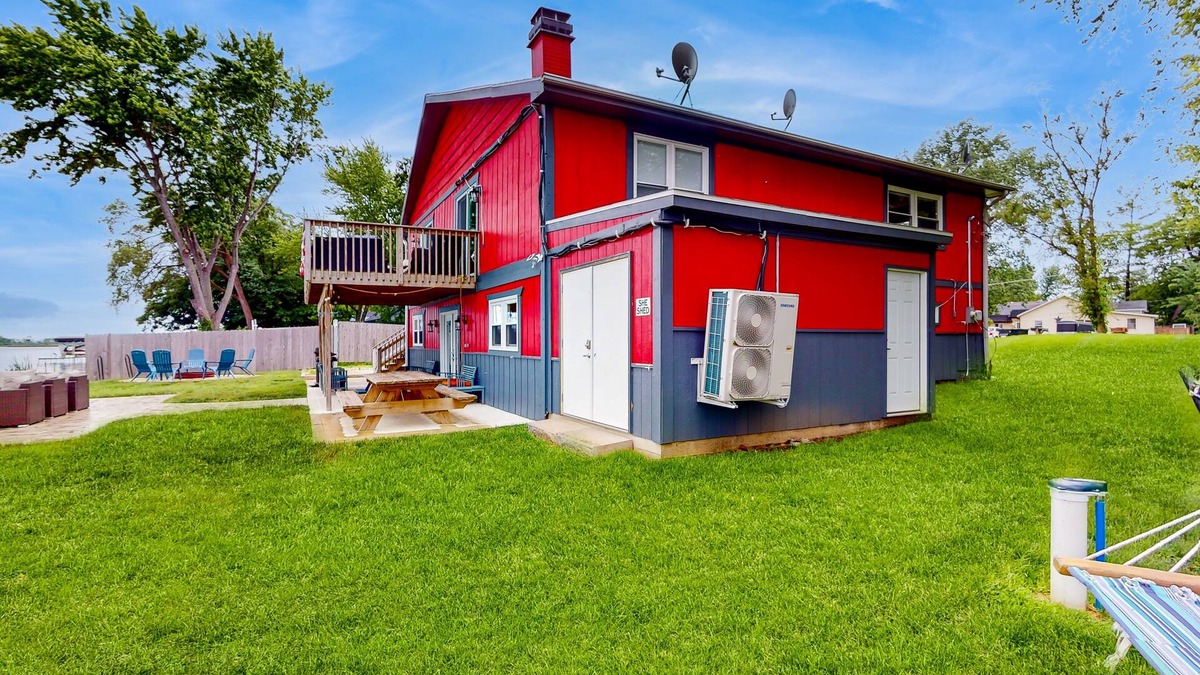 Channel Lake House | Lakefront home with firepit, 2 kitchens, & 2 W/Ds