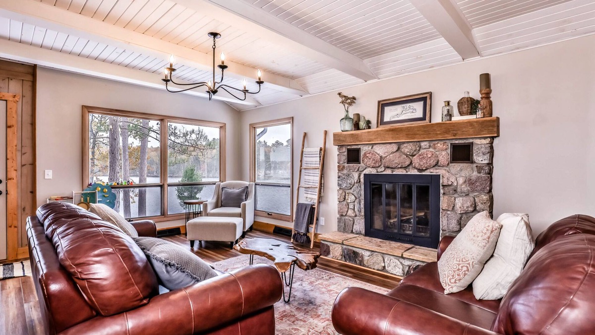 Sayner House | Lakefront home with private dock, deck, fireplace, firepit, canoe & paddleboat