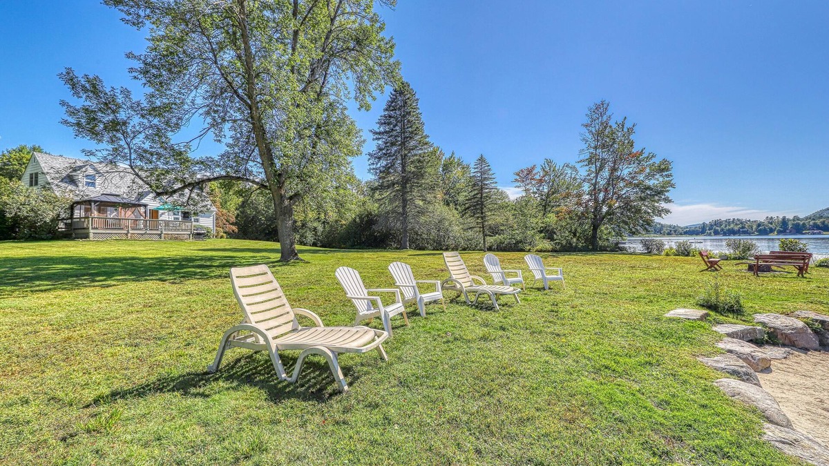 Brant Lake House | Lakefront house with 275' of waterfront, enclosed porch, & firepit