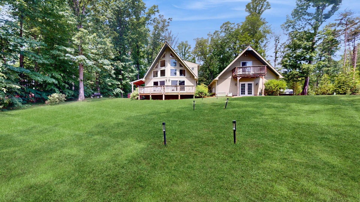 Bumpass House | Lakefront property with beach, dock, game tables, guest house, grill, W/D, & AC