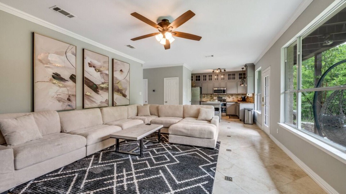 Little Elm House | Lakefront retreat just steps from Lake Lewisville! Enjoy 341 ft of shoreline, a private cove, sandy beach, fire pit, and pergola with built-in grill. Inside: lake views, travertine floors, cozy fireplace, and an upstairs game room with balcony.