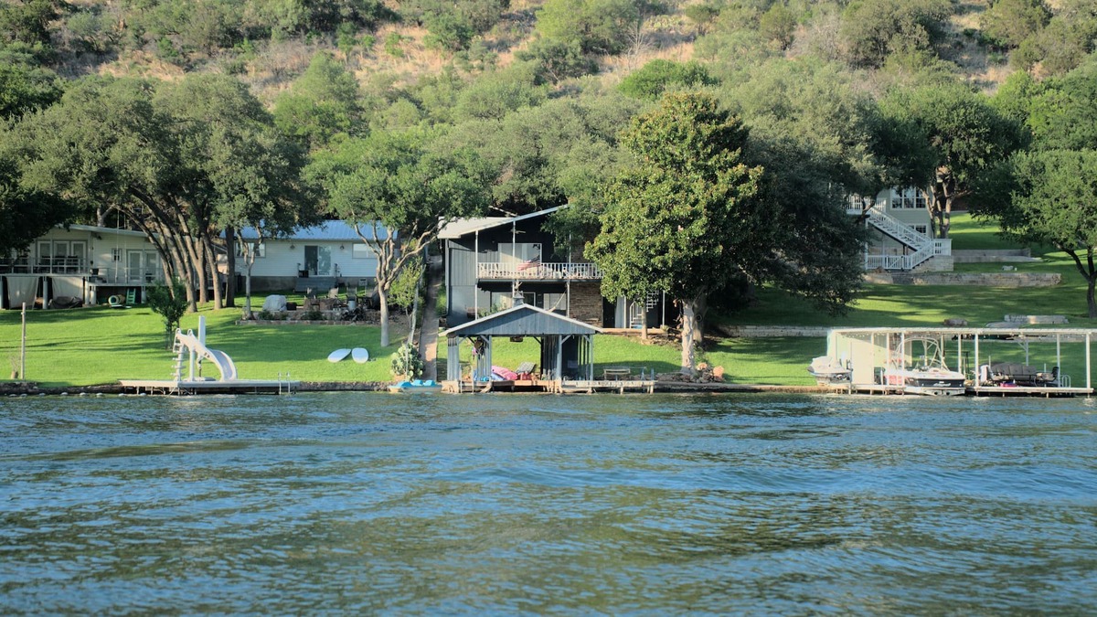 Sunrise Beach Village House | Lakefront retreat on quiet cove with large deck and sweeping views.
