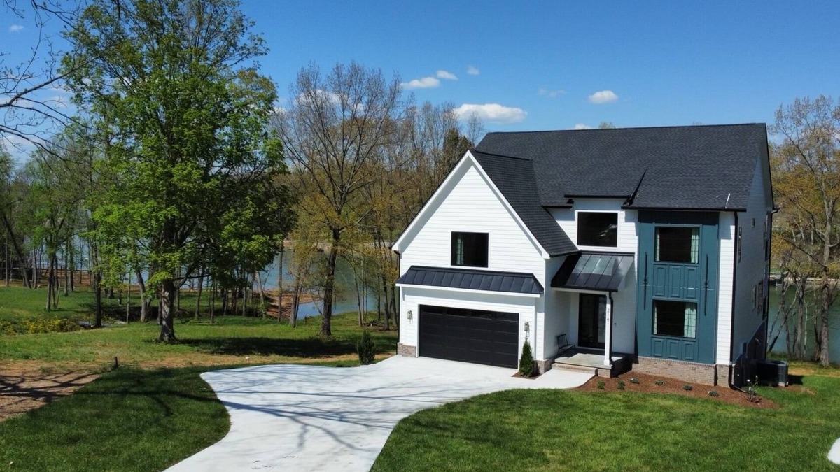 Winchester House | Lakeshore Modern! Lake front with platform dock and 2 kayaks, firepit and views