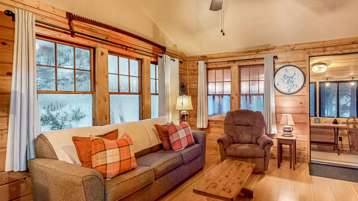 Three Lakes Cabin | Lakeside cabin with a firepit, sunroom, & seasonal dock