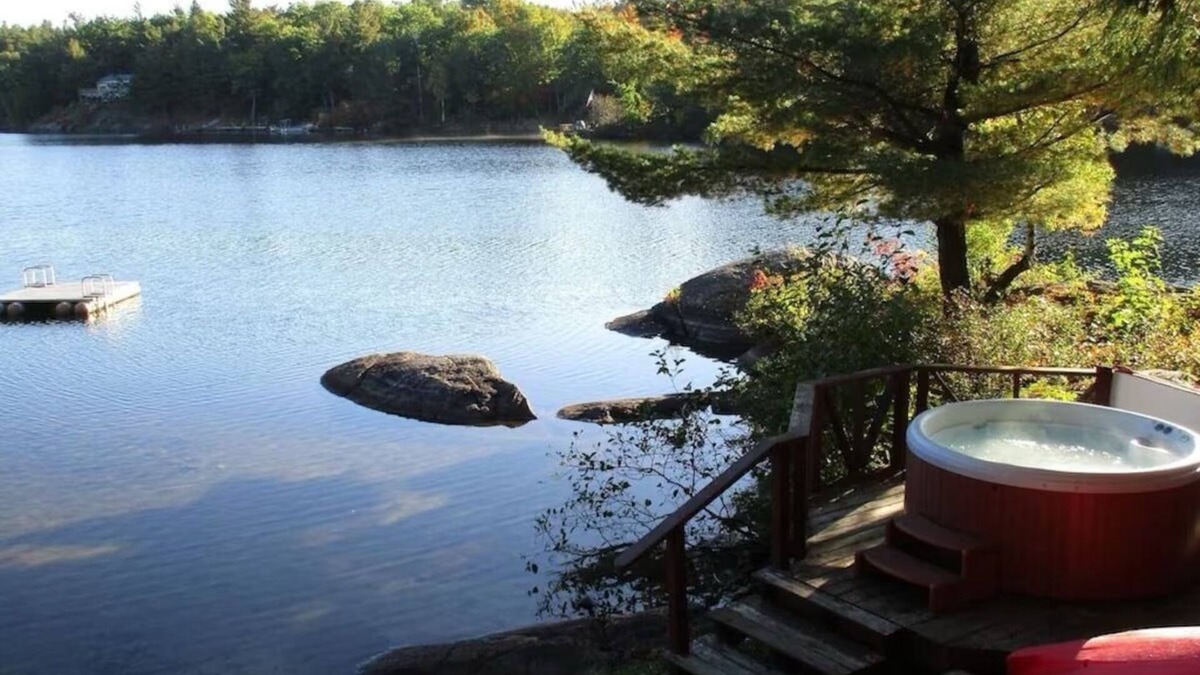 Town of Hermon Cottage | Lakeside Cottage near Adirondacks, Hot Tub, Pontoon Boat, Kayaks & Paddle Board
