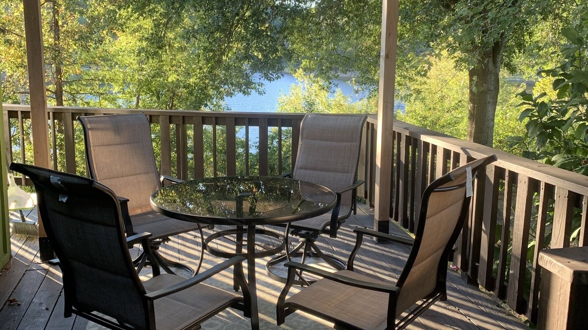 Springdale House | Lakeside house with fireplace, deck, and a fenced backyard with firepit.