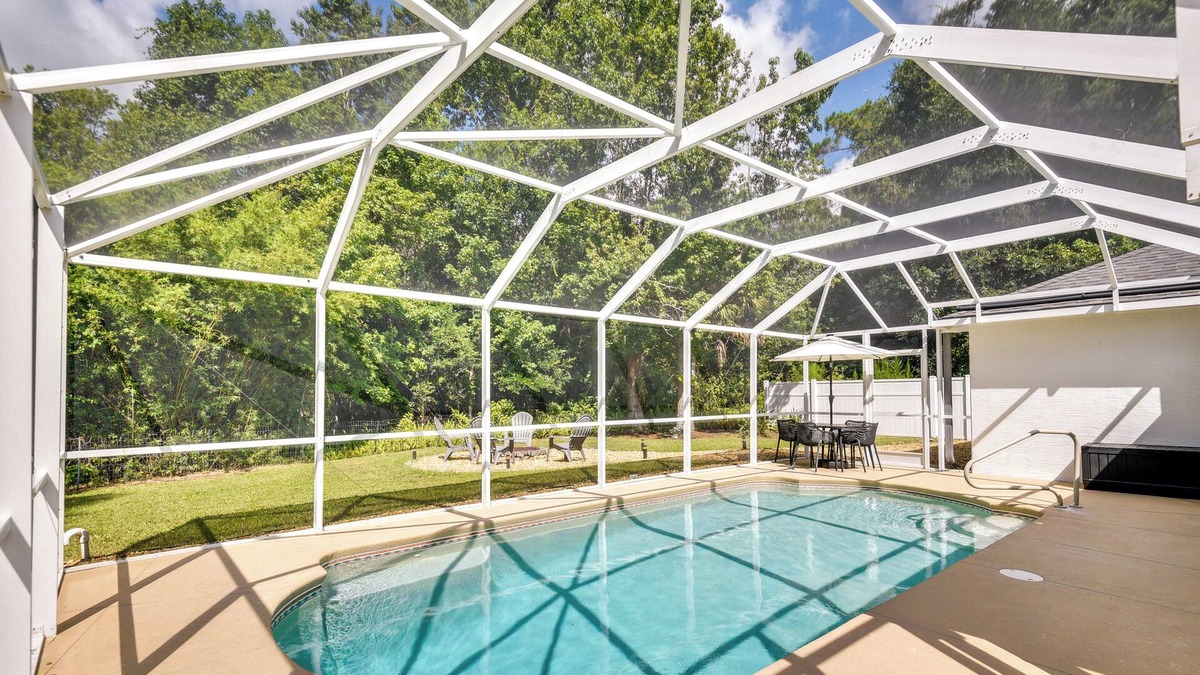 Palm Coast House | Lanai & Fire Pit: Peaceful Palm Coast Home!