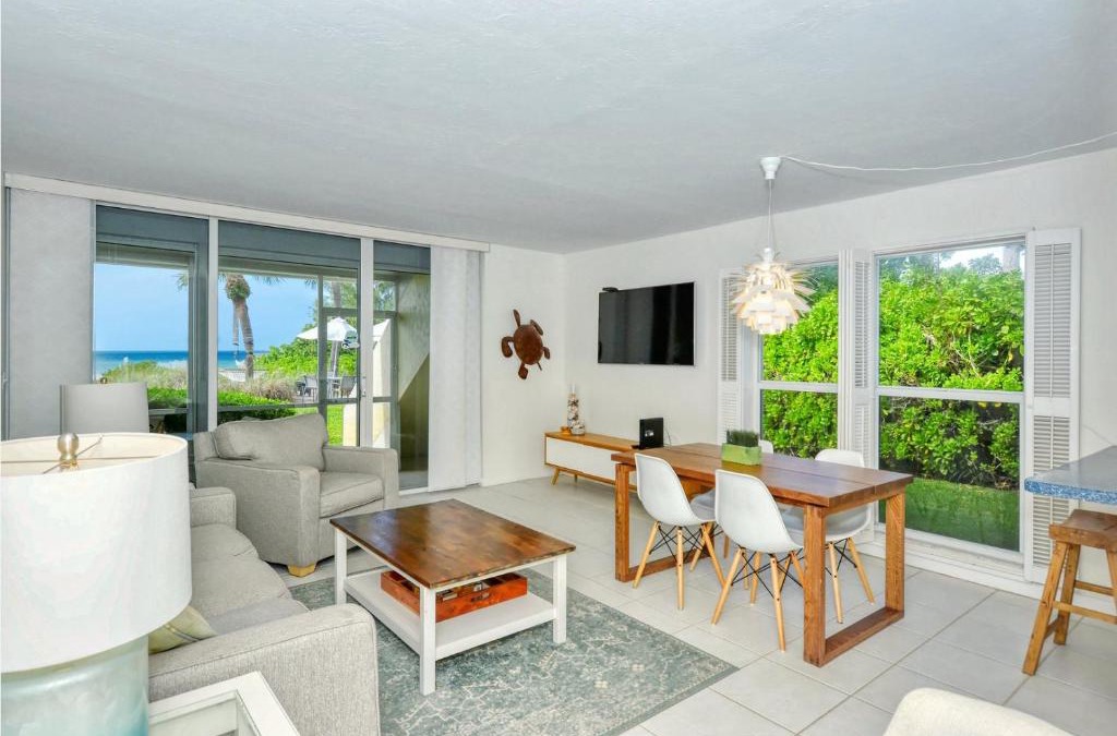 Longboat Key Apartment | LaPlaya 101A Step out to the beach from your screened lanai Light and bright end unit
