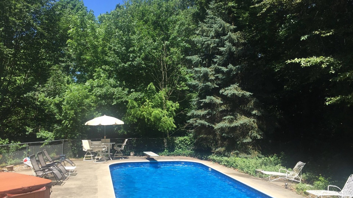 Macatawa House | Large family home with private POOL and hot tub on heavily wooded lot