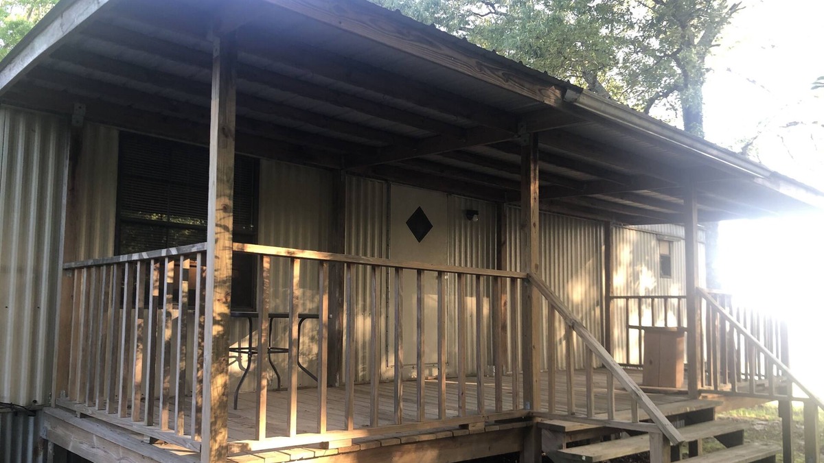 Bastrop House | Large porches overlooking acres of lawn and pasture near lakes and rivers.