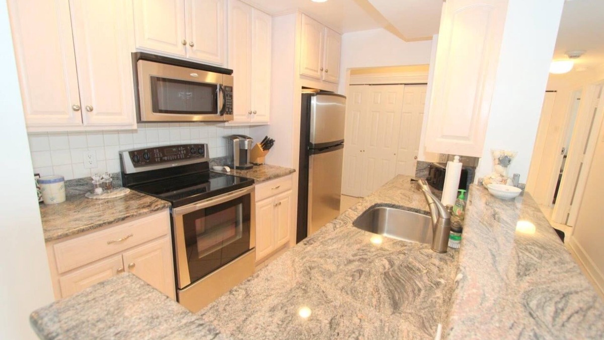 Rehoboth Beach Condo | LINENS & DAILY ACTIVITIES INCLUDED! OCEANFRONT/BOARDWALK BUILDING/ROOFTOP POOL Beautifully updated unit remodeled kitchen, great decor and views of the ocean,