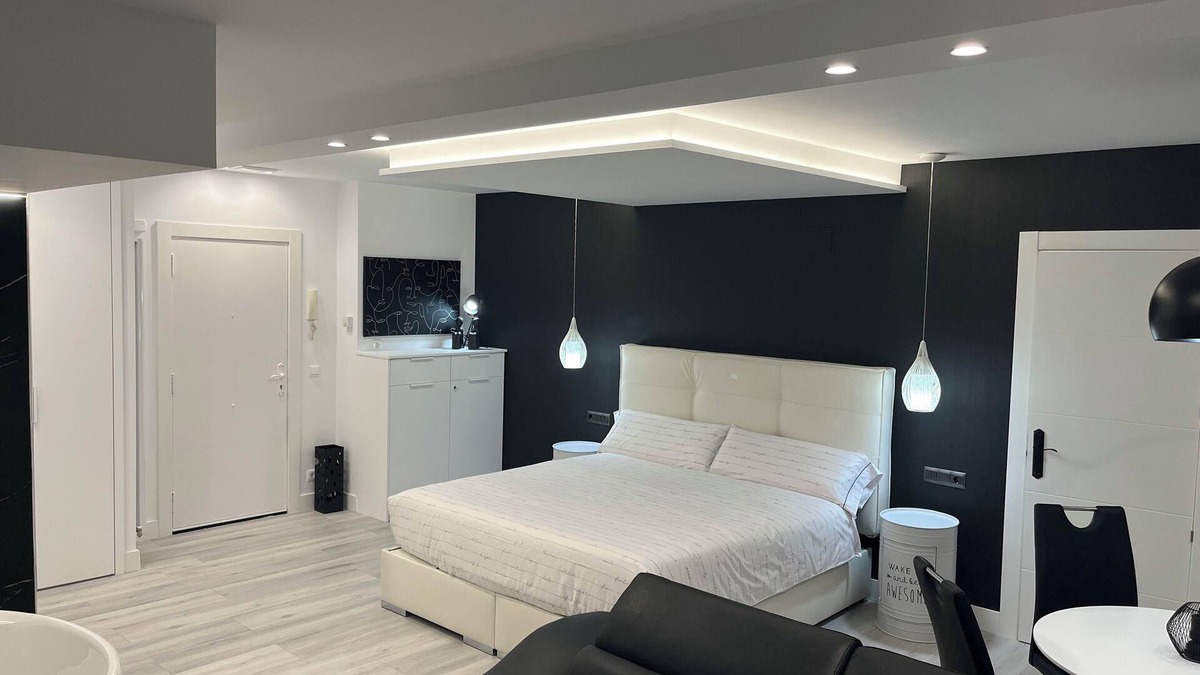 Castro Urdiales Apartment | Loft apartment "Black and White Suite Castro" with Jacuzzi and fireplace.
