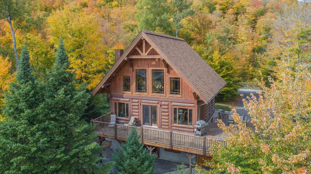Les Pays-d'en-Haut Regional County Municipality House | Log Cabin Home with Lake and Mountain view by Reserver.ca