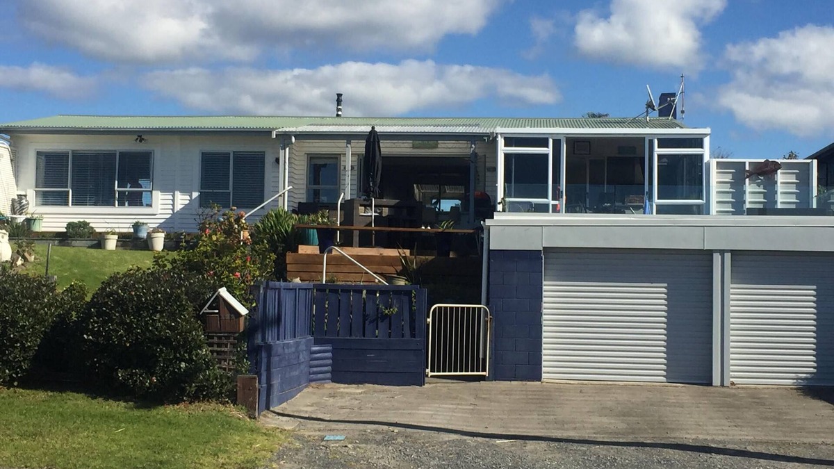 Waihi Beach House | Lovely sunny home with beach views to the front and county views at the back.