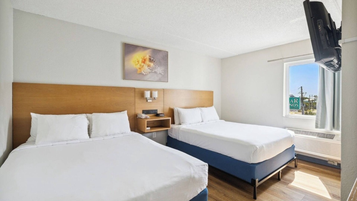 Fort Bay Hotel | Luxurious Beachfront Suite with Queen Beds, Kitchen, and Split Accommodations