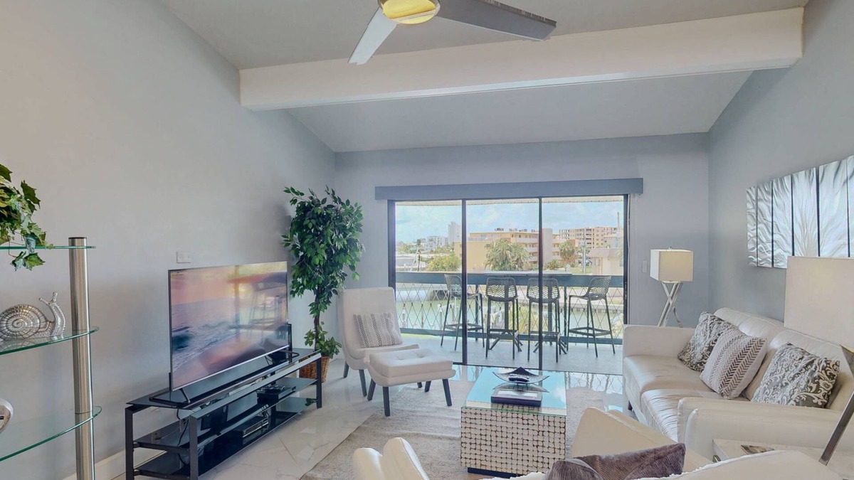 Capri Isle Condo | Luxurious Coastal Condo with Waterway Views, Pool, Balcony, and Steps to Treasure Island Beach.