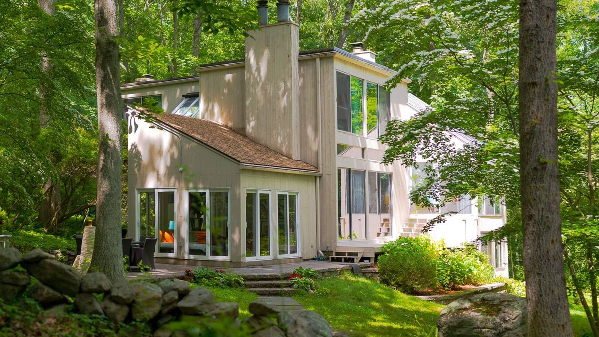 Old Lyme House | Luxurious midcentury modern glass house in the woods, chefs kitchen & great art