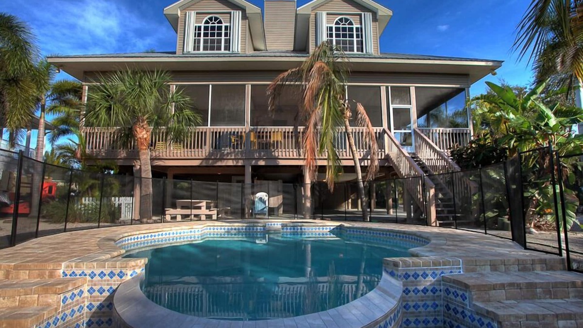 Palm Island House | Luxury 4 Bedroom pool home close to beach, private dock on Kettle Harbor.