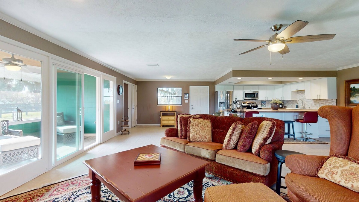 Micanopy House | Luxury duplex with private screened porch and lake view