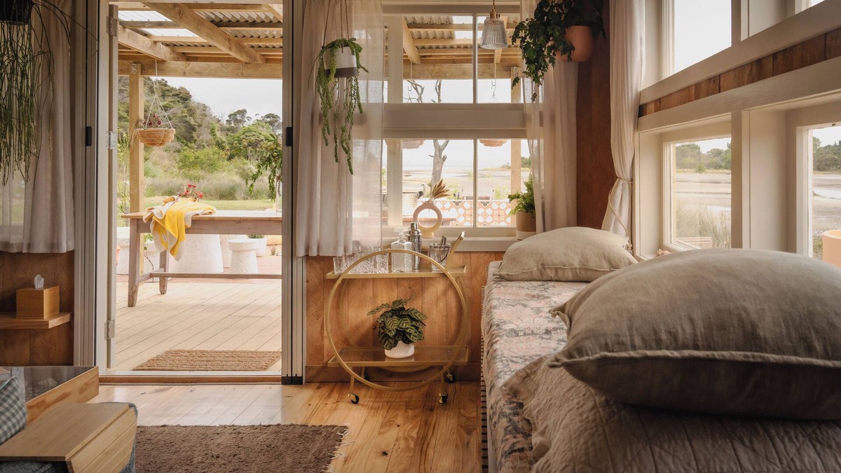 Pouto Cottage | Luxury eco-design waterfront fishing Batch with guests' vegetable garden.