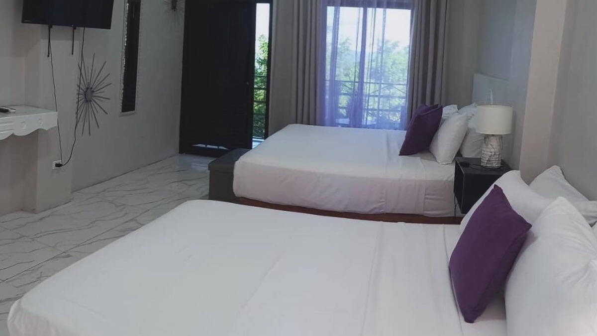 Port Antonio Hotel | Luxury havens with two kings or a king and queen bed, overlooking Port Antonio