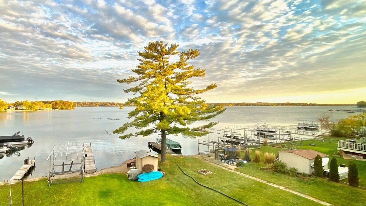 Pewaukee House | Luxury Lakefront Home w Miles of Lake Views, private pier, lake toys & game room