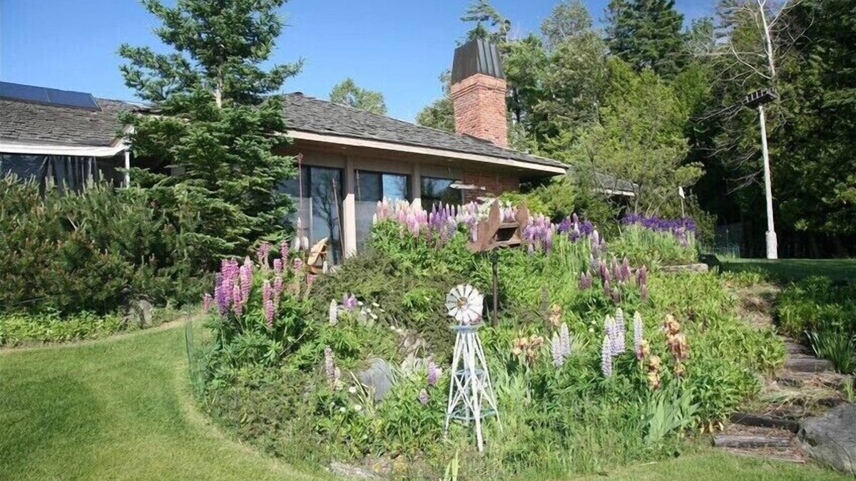 Charlevoix House | Luxury Lakefront Property with private dock, tennis court, trails & views