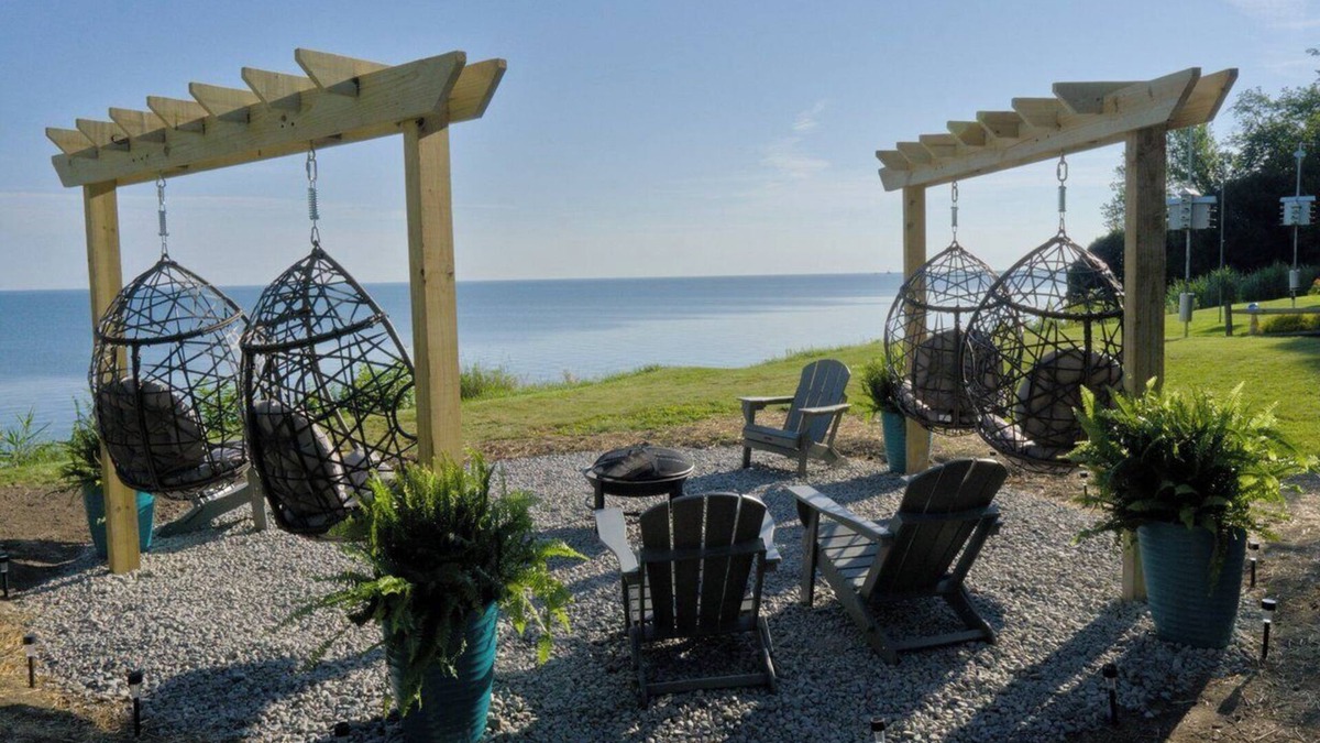 Ashtabula House | Luxury Lakefront Retreat: Panoramic Views, Game Room, Fire Pit Swings & More