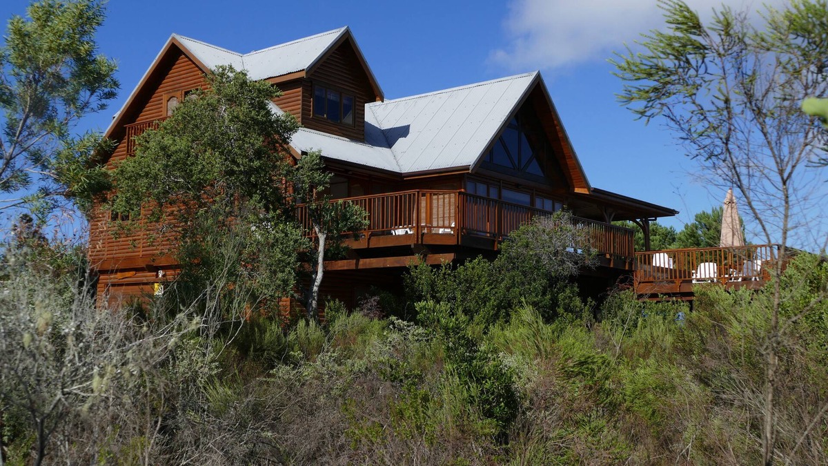 Wilderness House | Luxury log home with lake and mountain views, close to world-class golf courses