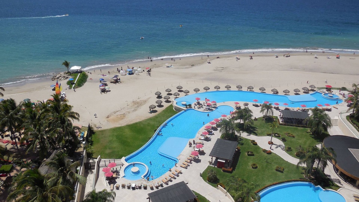 South Hotel Zone Condo | Luxury Oceanfront Apartment in Puerto Vallarta's Best Beach. 2 Large Pools, Gym