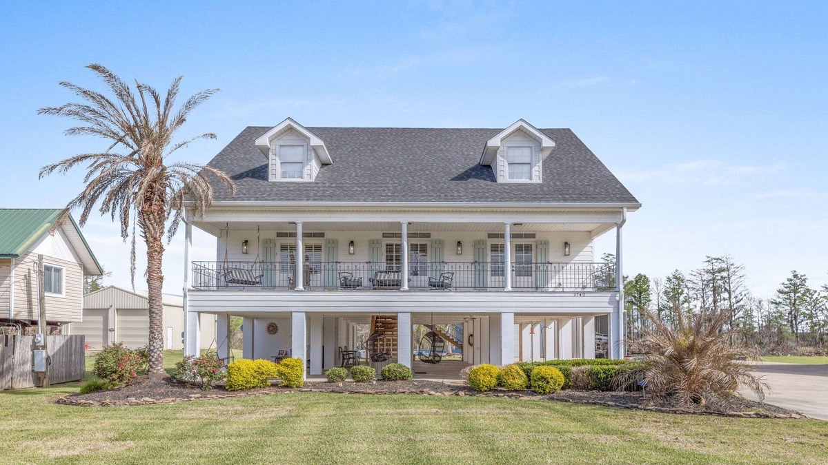Moss Bluff House | Luxury riverfront home w/pool, fishing dock, & boat house w/lift ! Sleeps 14