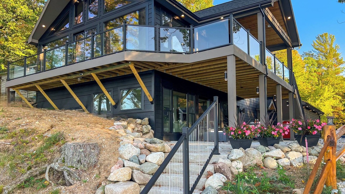 Kalkaska House | Luxury Scenic Lakeside Haven: Kayaks, Fire Pit, Multi-Deck, Game Room, Dock