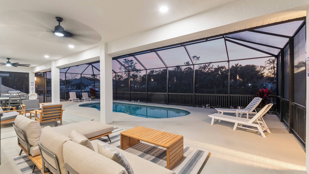 Palm Harbor House | Luxury Waterfront Escape – Private Dock, Heated Pool & Game Room! Pet-Friendly!