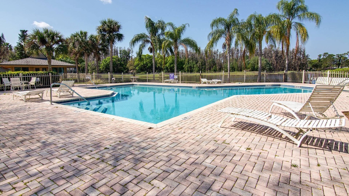 Fairway Village House | Magnolias on Cobblestone – Stylish Pet Friendly Retreat w/Private Lanai, Pool Access & Smart TVs!
