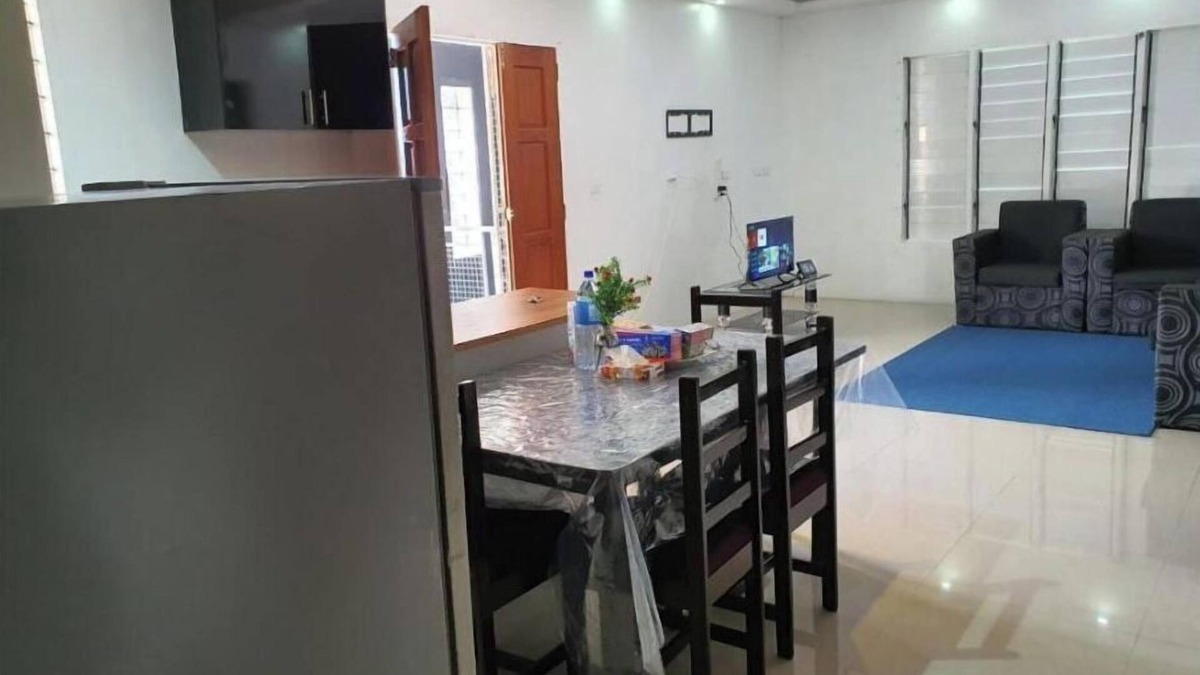 Suva Apartment | Master Bedroom with shared kitchen and living room