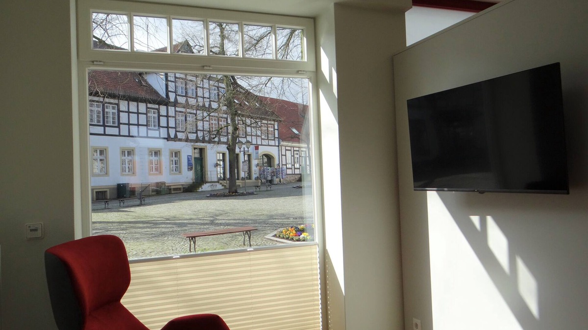 Bad Essen Apartment | Modern apartment with a fireplace in a listed half-timbered house on the market square