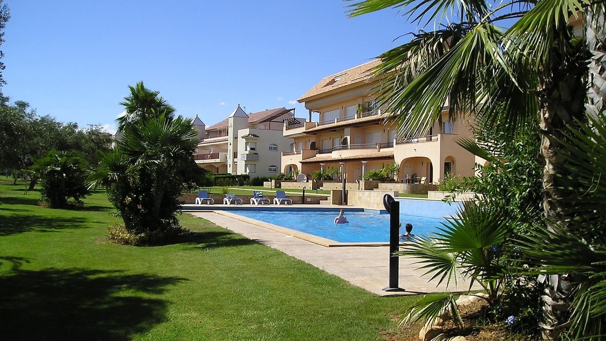 San Jorge House | Modern duplex house overlooking communal pool and gardens at Golf Panoramica.