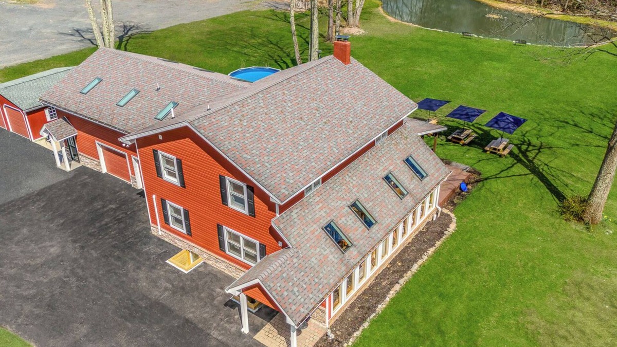 Canadensis House | Modern Farmhouse w/heated pool, hot tub, fishing pond, movie theater, game room