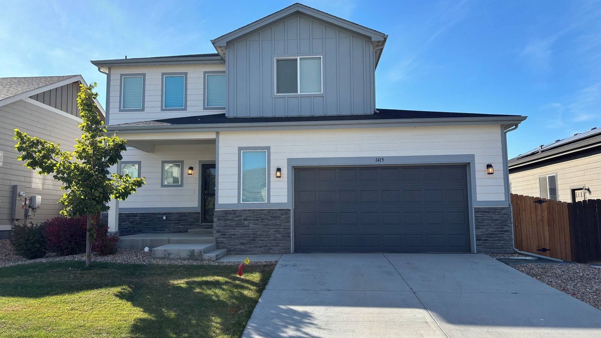 Milliken House | Modern home with a large fenced yard, and garage access