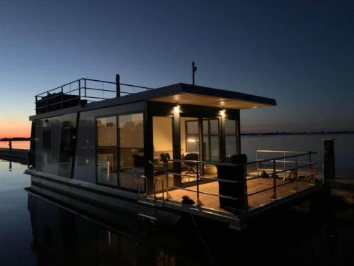 Offingawier Boat Rental | Modern houseboat in Offingawier with terrace